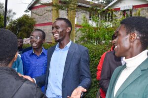 Mheshimiwa Ken Babu having a light moment with his team